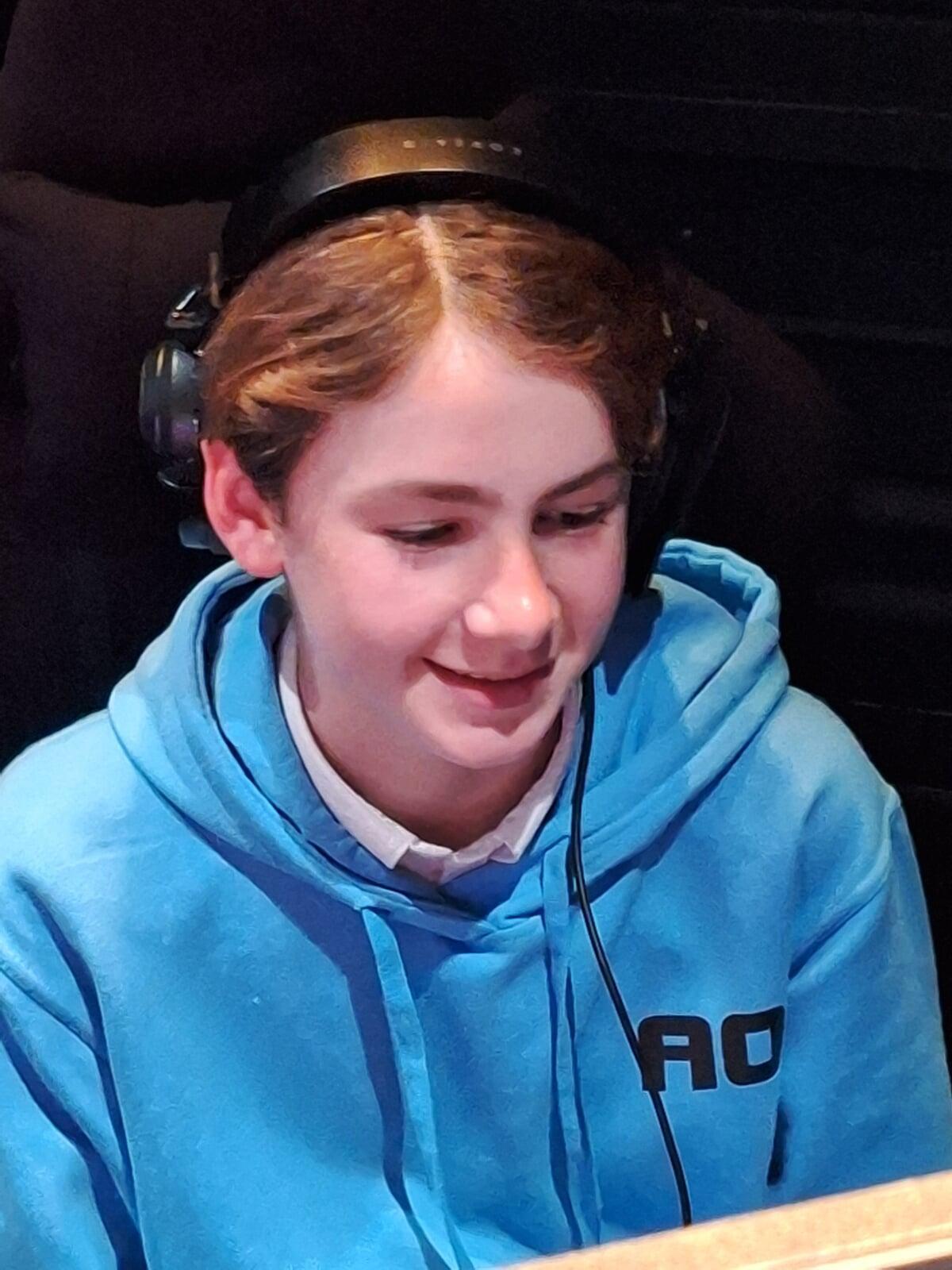 A boy from Hinchley Wood smiles after winning a game